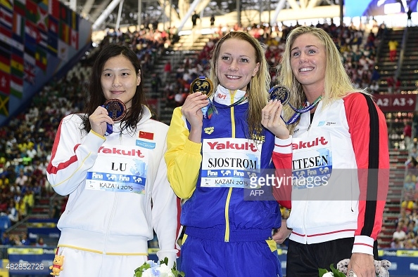 Not sure if the 50m butterfly podium or the 100m butterfly podium... Also notice the melancholic look by Ottesen!