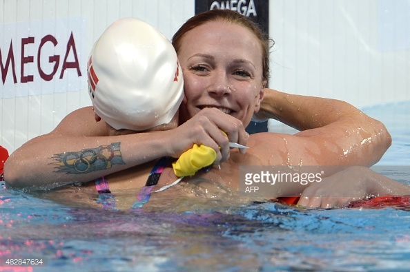 This photo has the three main things you should take home from this post - 1) Sjostrom, 2) her kick-ass tattoo, and 3) Ottesen